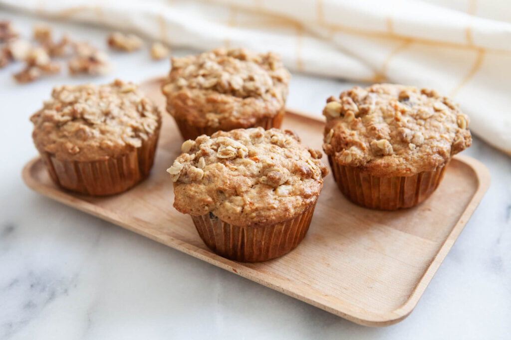 carrot cake muffins with homemade butter on counter top