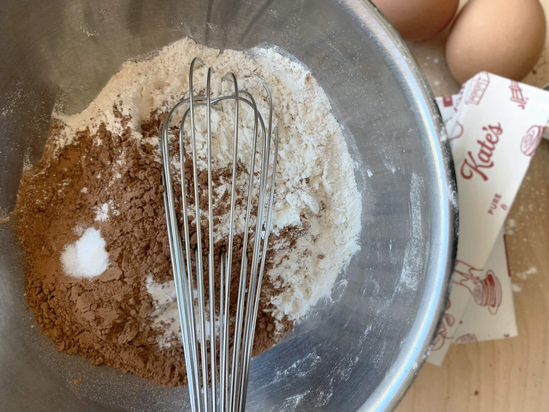 cookie ingredients in a bowl with a whisk