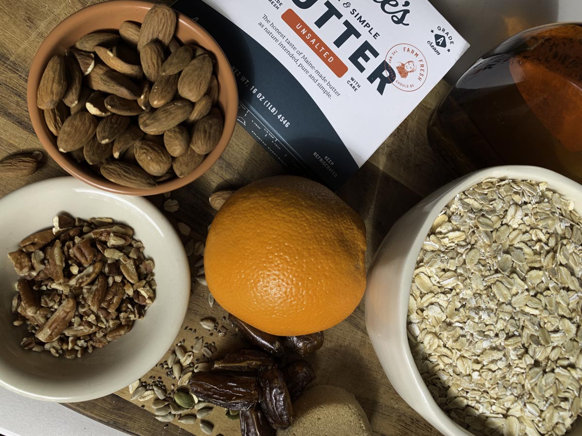 Nuts, granola, oats, an orange and Kate's Unsalted Butter